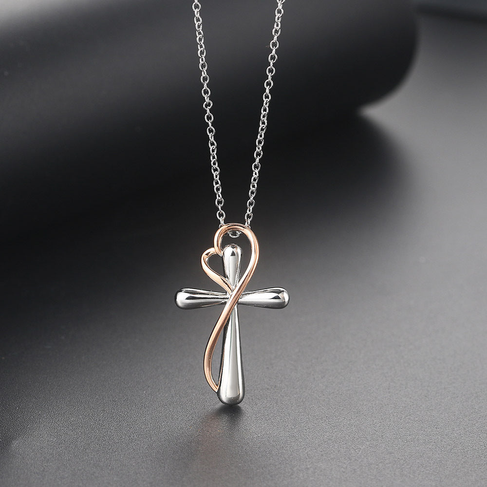 Collier croix enlacé d'un coeur